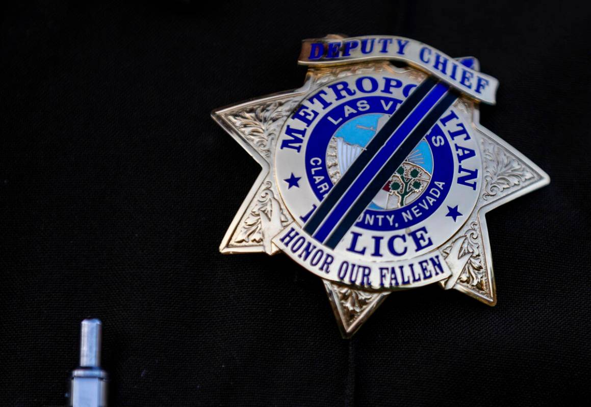 Metropolitan Police Officers wear their badges with black bands to honor the fallen during the ...