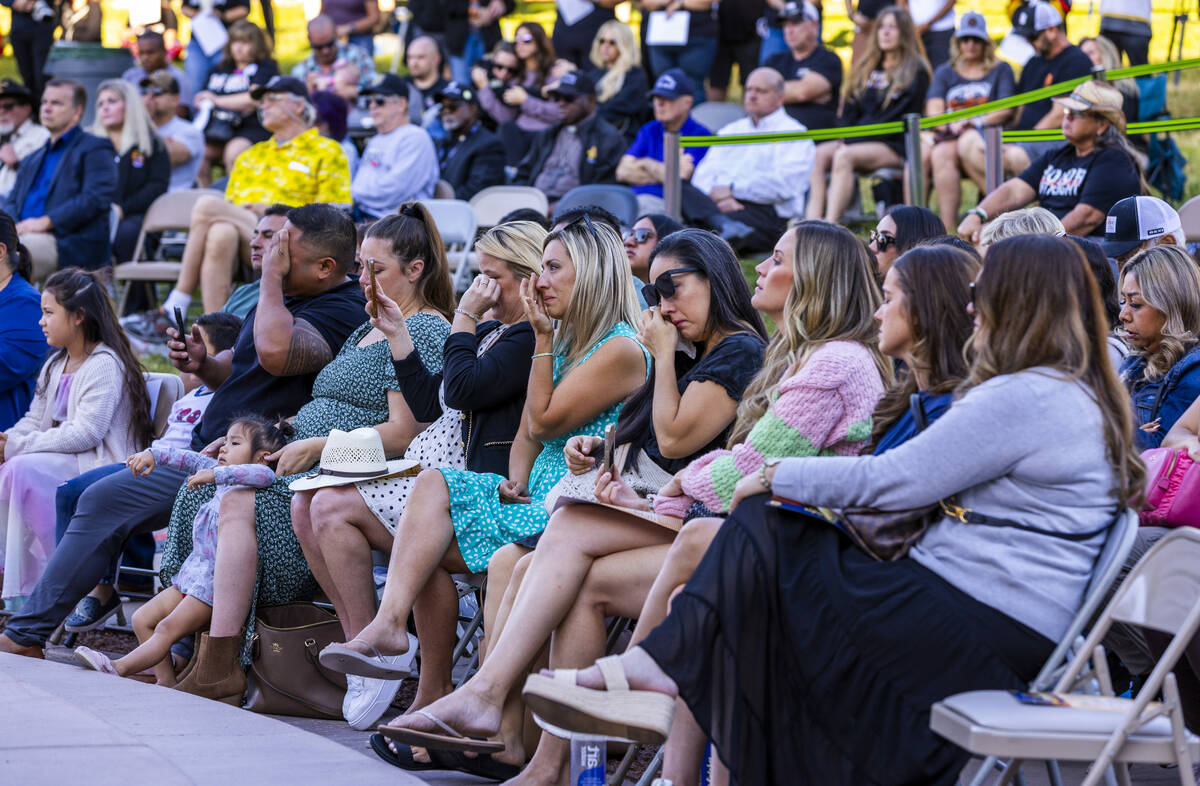 Participants become emotional as parent Jeff Poole speaks of his daughter Kerri Lynn Galvan, on ...