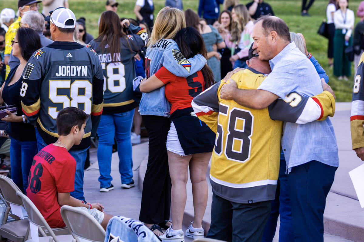 Participants offer each other condolences and well wishes during the 1 October Sunrise Remembra ...