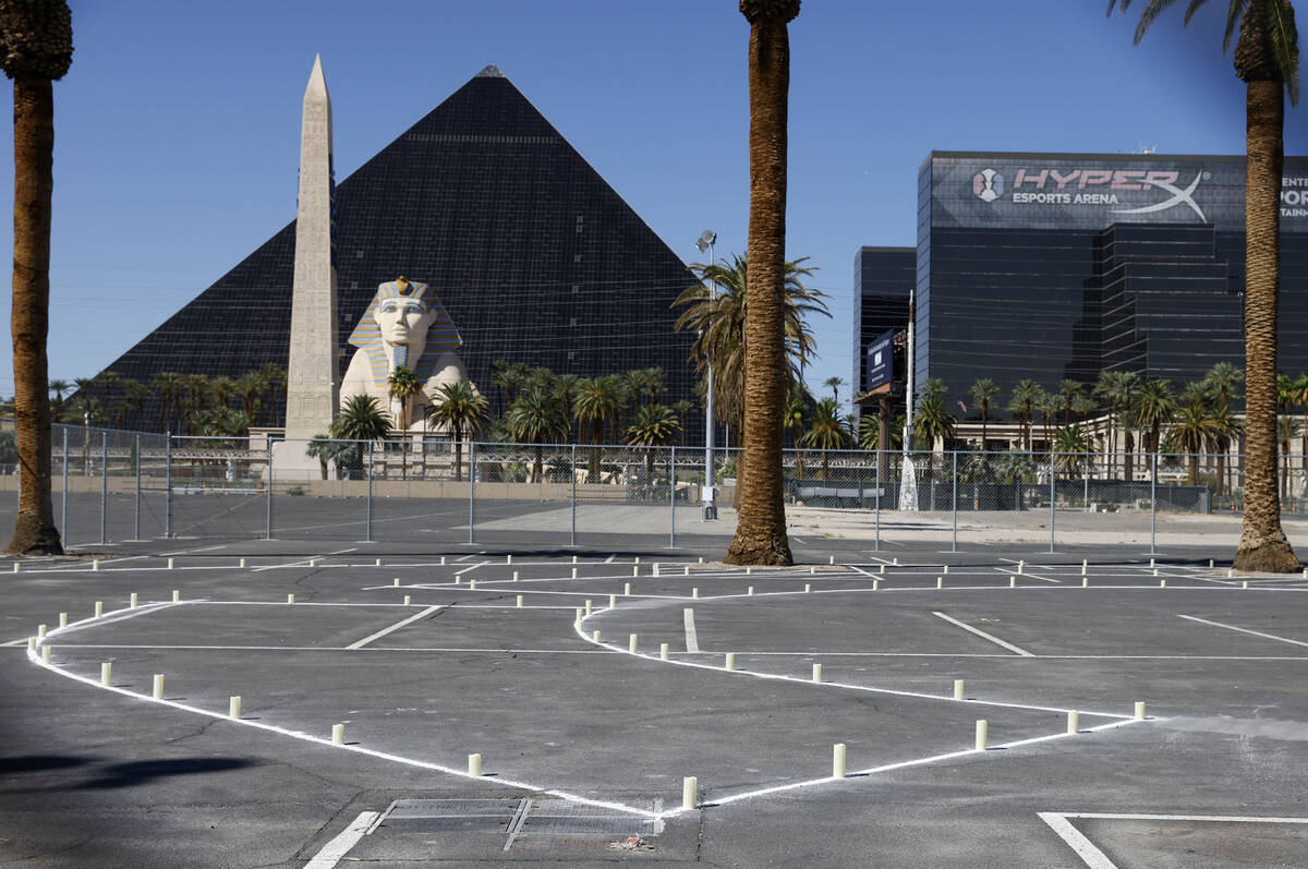 Candles and rocks are placed on Wednesday Oct. 1, 2025, at the site where sixty people were kil ...