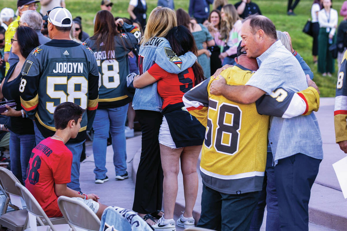 Participants offer each other condolences and well wishes during the 1 October Sunrise Remembra ...