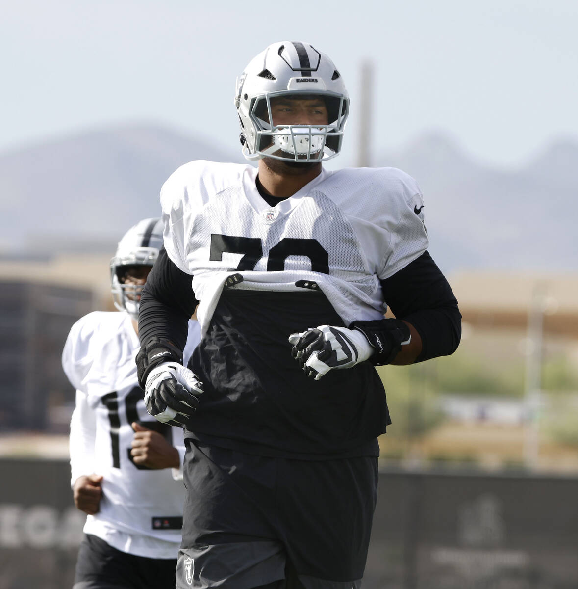 Raiders offensive tackle Stone Forsythe (70) warms up during team practice at the Intermountain ...