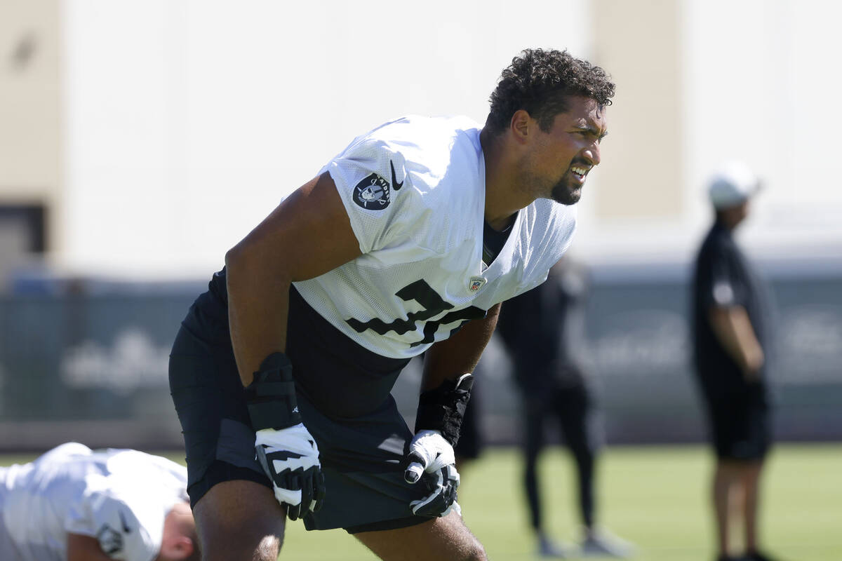 Raiders offensive tackle Stone Forsythe (70) stretches during practice at the Intermountain Hea ...