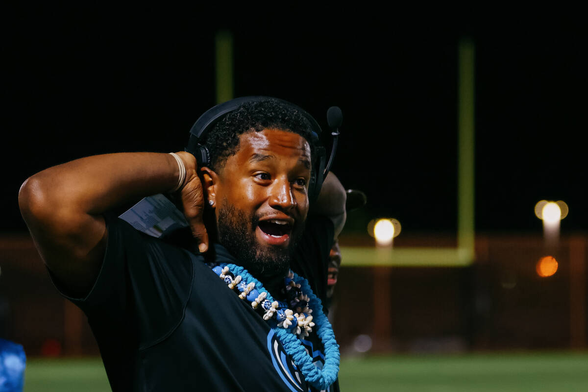 Sloan Canyon assistant coach JD Alexander reacts to an incomplete pass for the Pirates during a ...