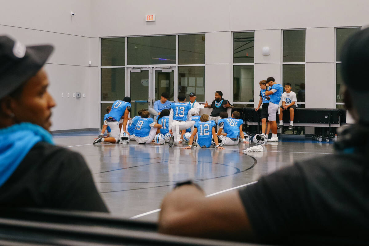 Part of Sloan Canyon’s offense gathers to hear coaches speak at halftime on Friday, Sept ...