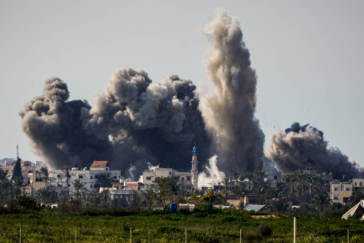 FILE - Smoke and explosion following an Israeli bombardment inside the Gaza Strip, as seen from ...