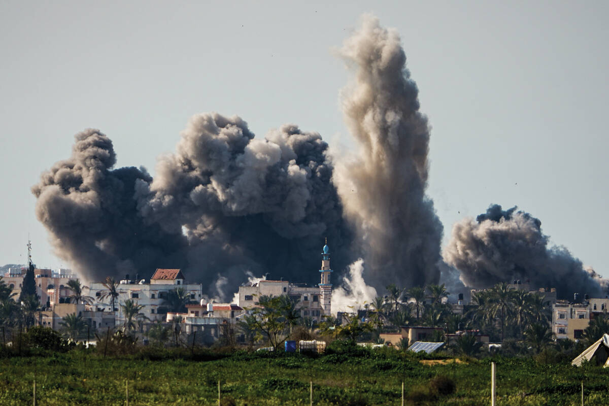 FILE - Smoke and explosion following an Israeli bombardment inside the Gaza Strip, as seen from ...