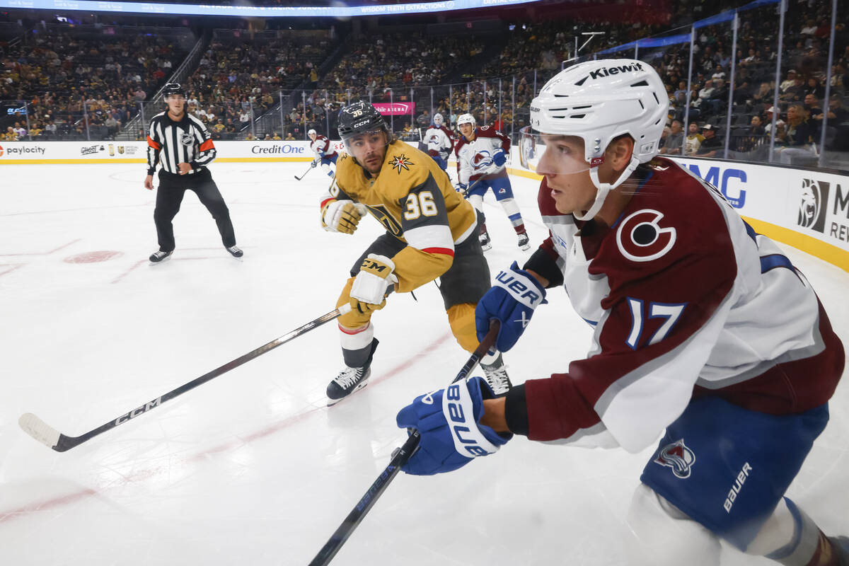 Golden Knights center Raphael Lavoie (36) looks to take Colorado Avalanche center Parker Kelly ...