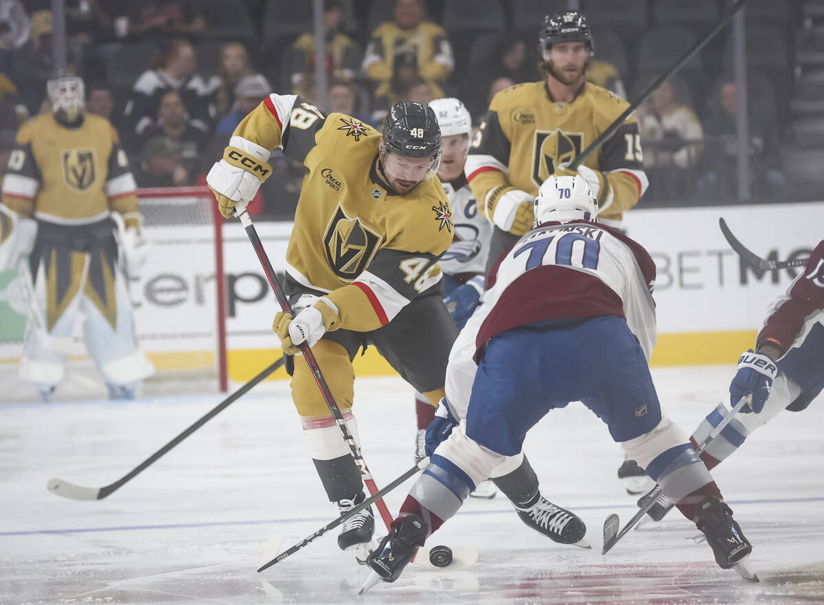 Golden Knights center Tomas Hertl (48) skates with the puck under pressure from Colorado Avalan ...
