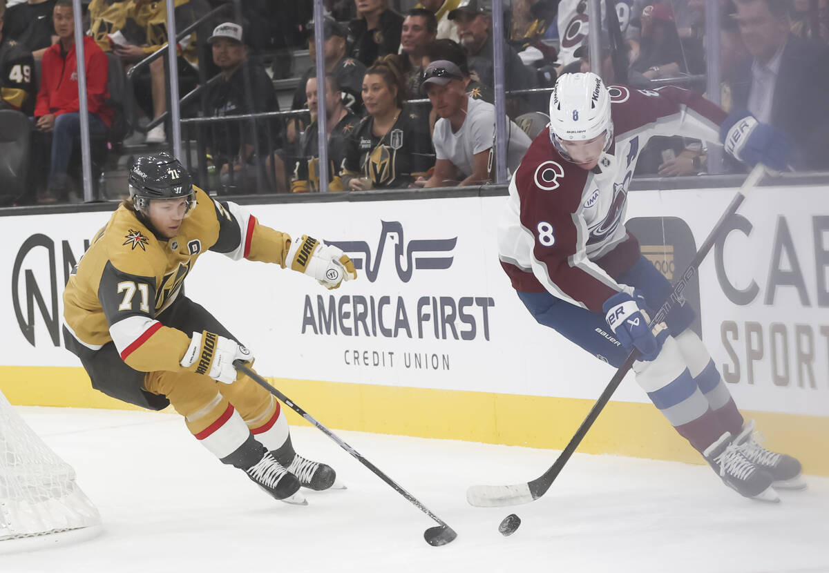 Golden Knights center William Karlsson (71) and Colorado Avalanche defenseman Cale Makar (8) vi ...