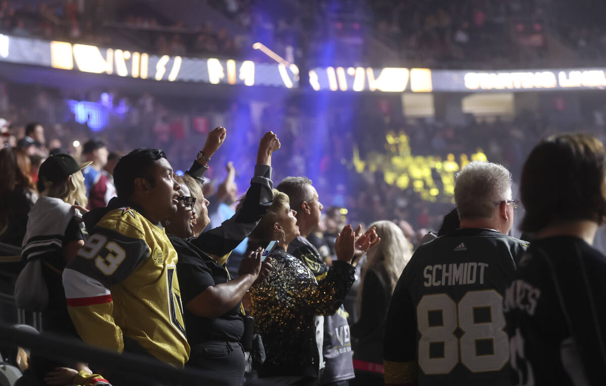 Golden Knights fans cheer before the start of an NHL hockey preseason game against the Colorado ...