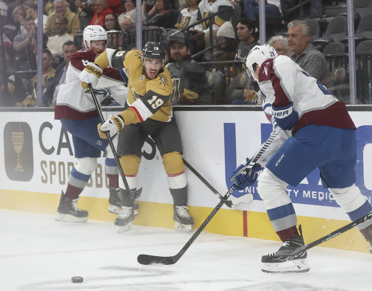 Golden Knights right wing Reilly Smith (19) passes the puck under pressure from Colorado Avalan ...