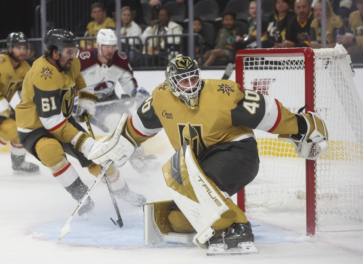 Golden Knights goaltender Akira Schmid (40) defends the net during the second period of an NHL ...
