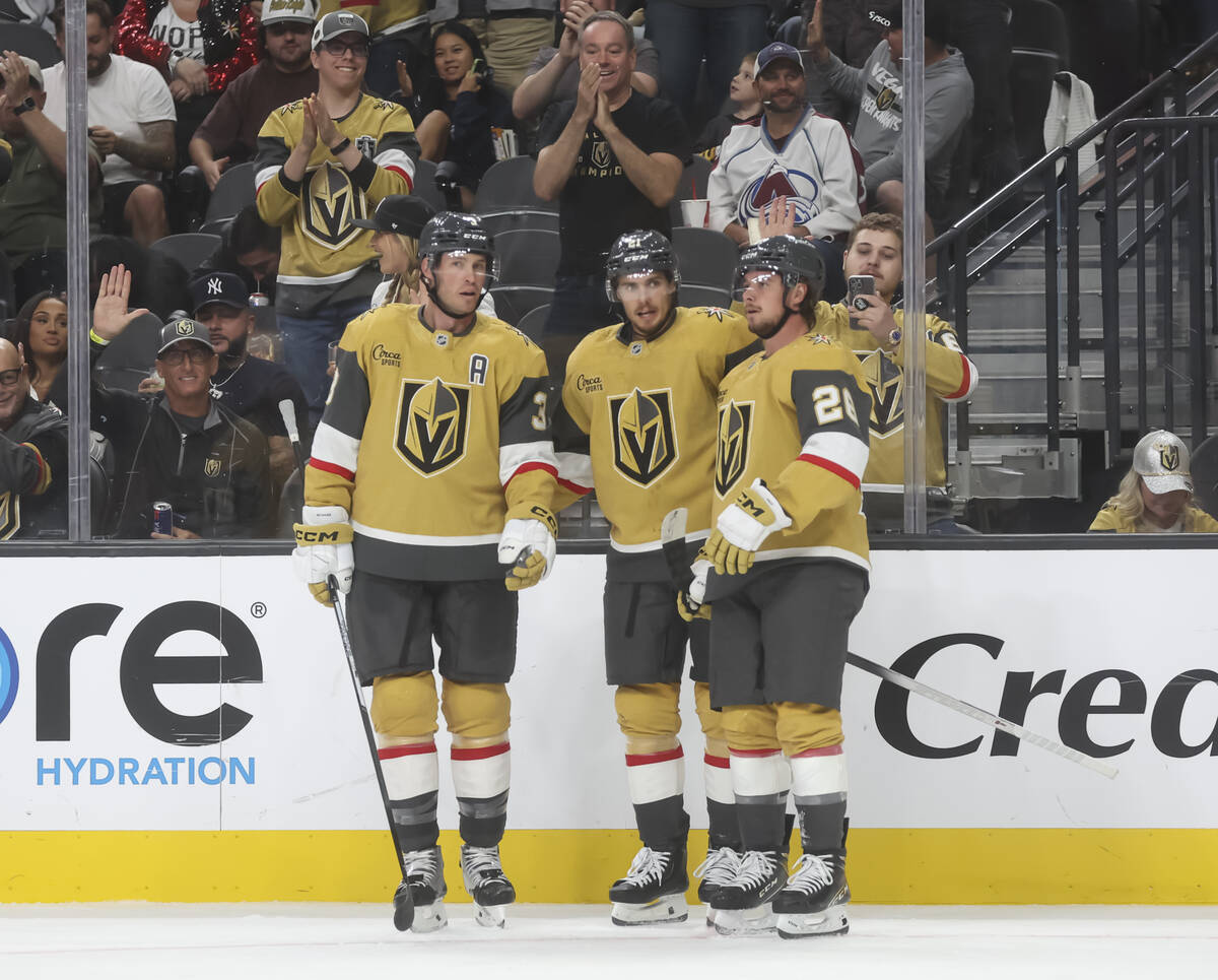 The Golden Knights celebrate after a goal against the Colorado Avalanche during the third perio ...