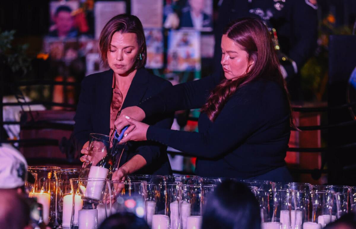 Candles are lit during a ceremony in honor of the victims of the Oct. 1 shooting at the Las Veg ...
