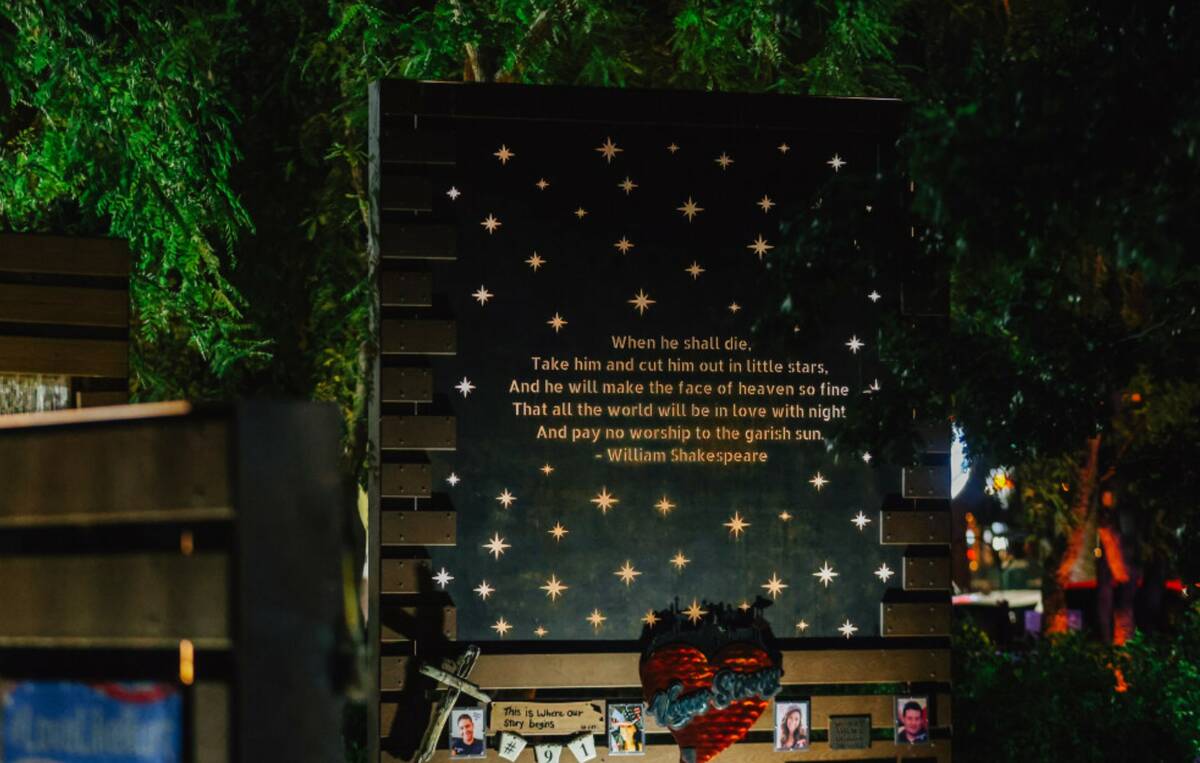 A quote is illuminated during a ceremony in honor of the victims of the Oct. 1 shooting at the ...