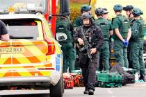 An armed police officer at the scene of a stabbing incident at Heaton Park Hebrew Congregation ...