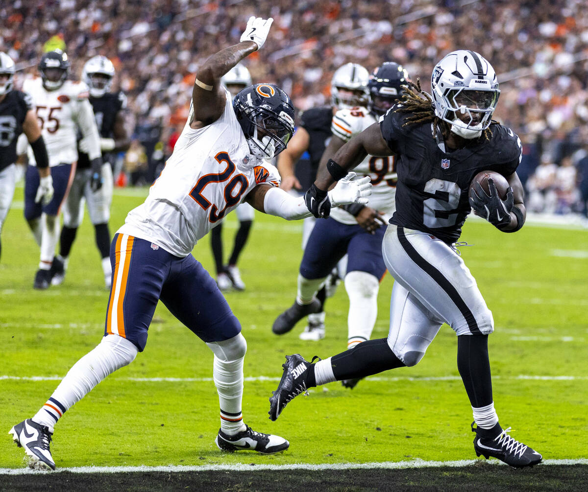 Raiders running back Ashton Jeanty (2) scores a touchdown as Chicago Bears cornerback Tyrique S ...