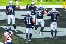 Raiders running back Ashton Jeanty (2) celebrates a touchdown with teammates against the Chicag ...