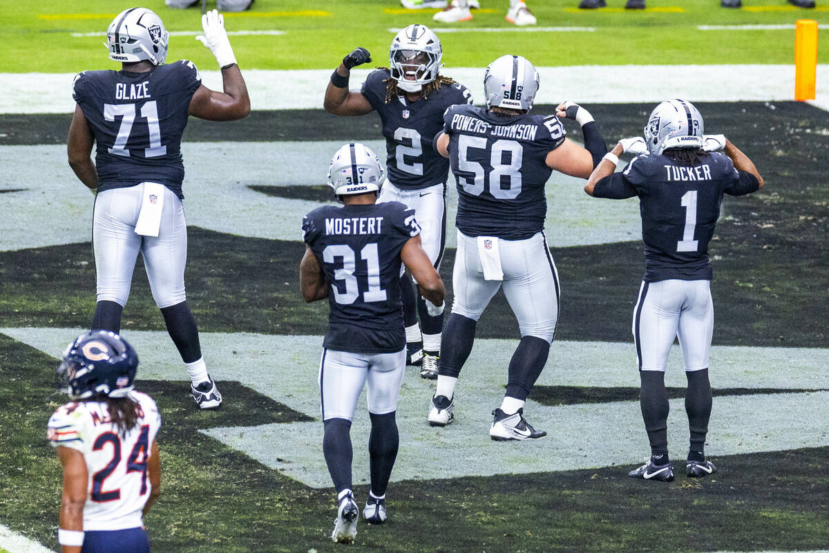 Raiders running back Ashton Jeanty (2) celebrates a touchdown with teammates against the Chicag ...