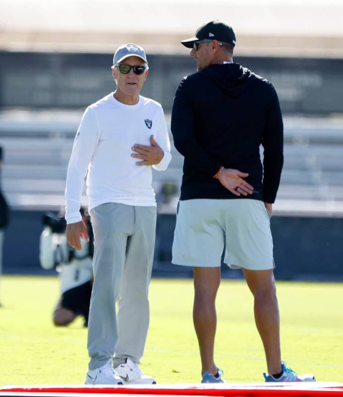 Raiders head coach Pete Carroll, left, and General Manager John Spytek discuss during the team& ...