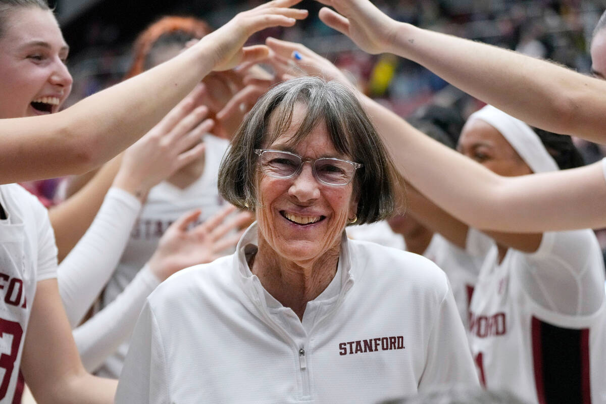 Stanford coach Tara VanDerveer smiles as players celebrate her 1,202nd victory as a college coa ...