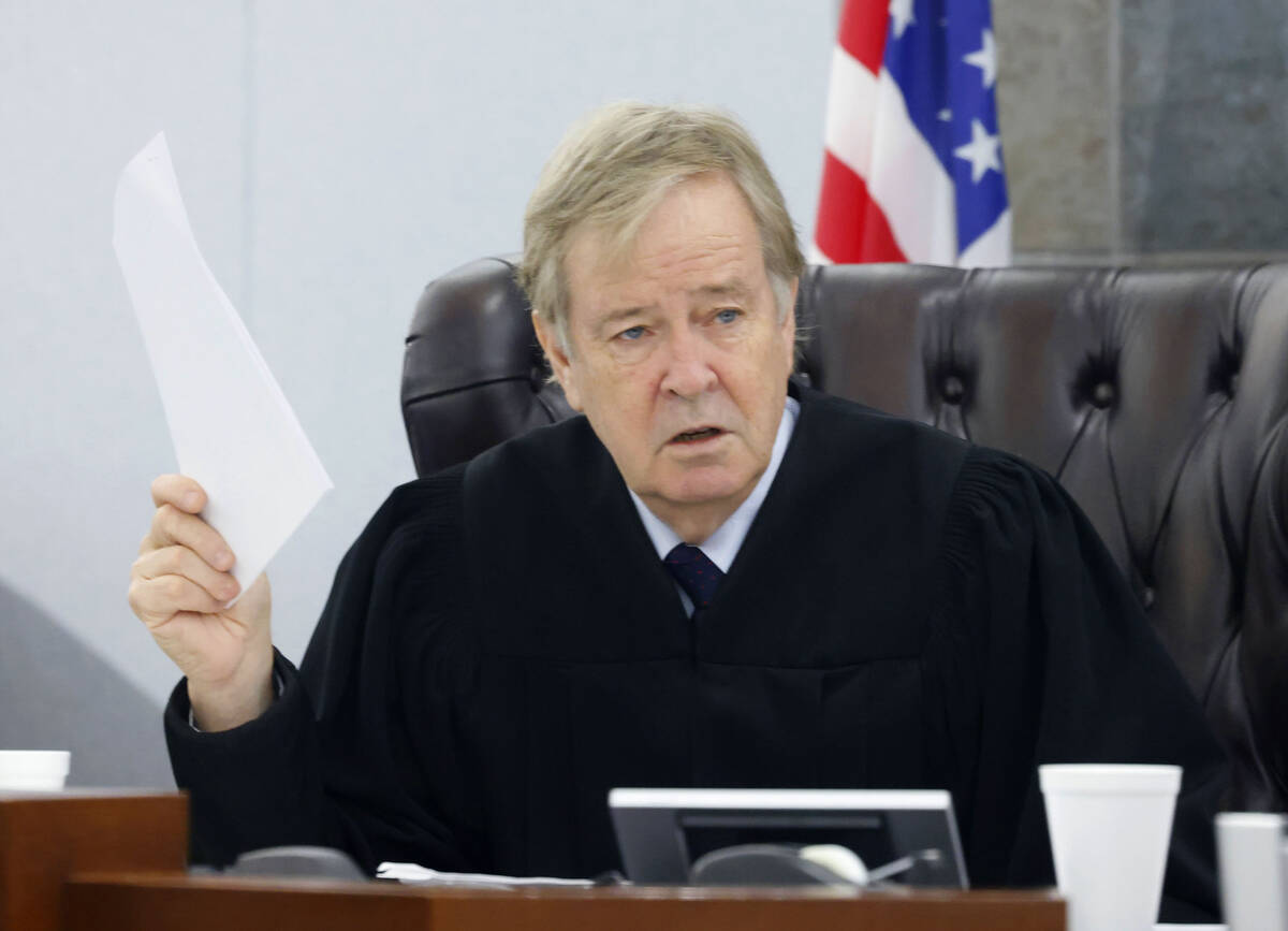 District Judge Eric Johnson presides over a plea hearing for Stanley Weaver, accused of stalkin ...