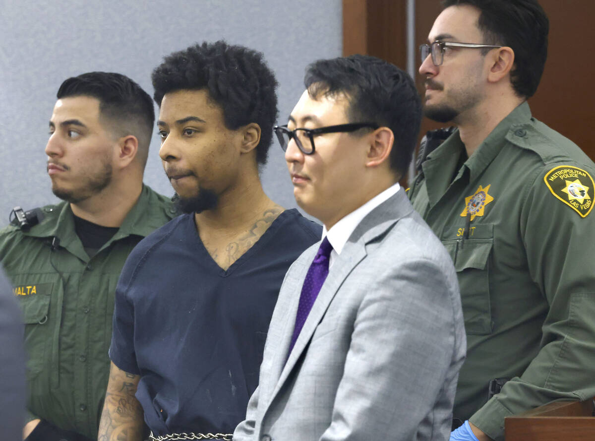 Stanley Weaver III, second left, accused of stalking Gov. Joe Lombardo, appears in court with h ...