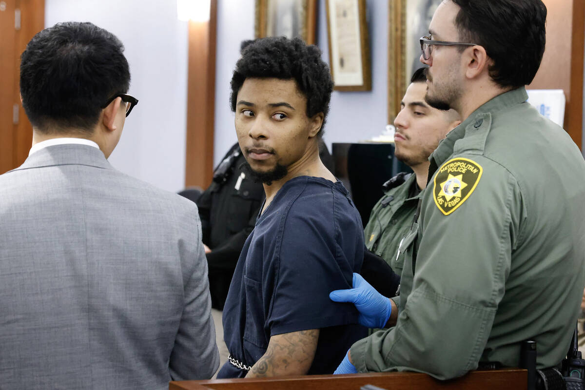 Stanley Weaver, center, accused of stalking Gov. Joe Lombardo, scans the courtroom as he appear ...