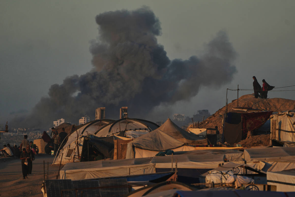 Smoke rises following an Israeli military strike in Gaza City, as seen from the central Gaza St ...