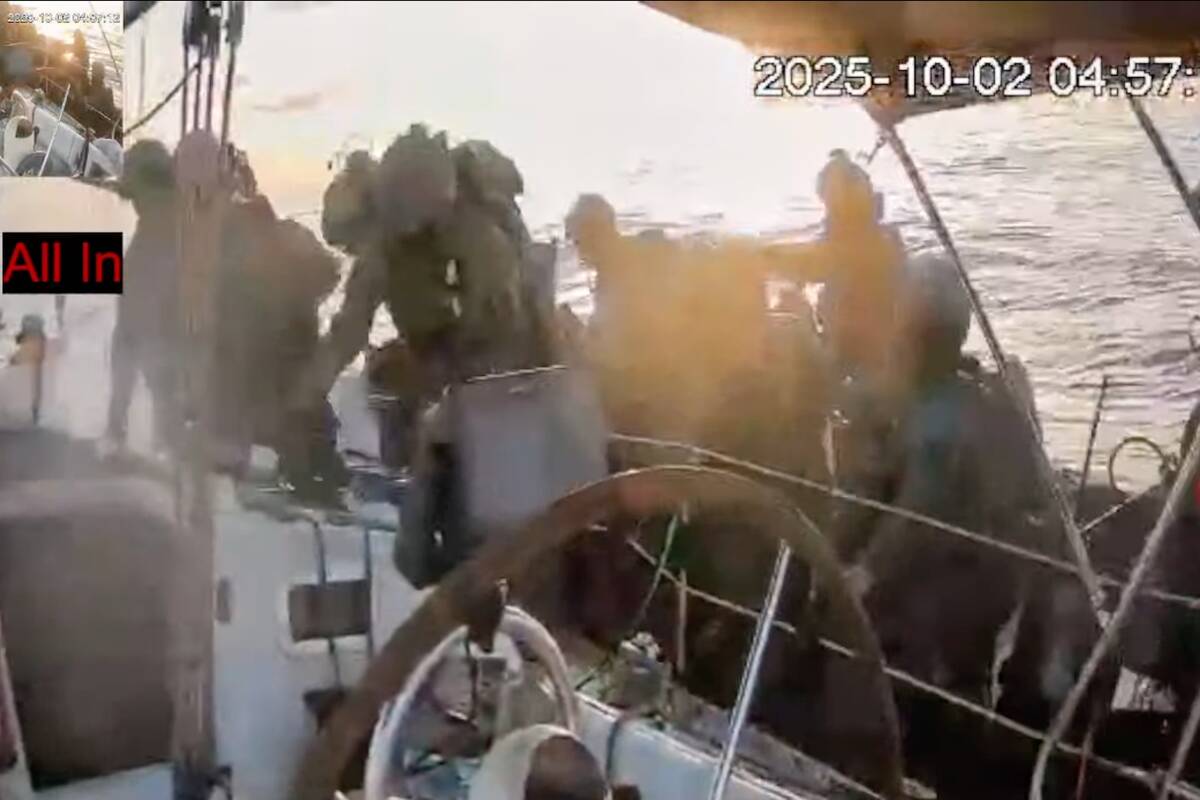 This frame grab from video released by the Global Sumud Flotilla shows Israeli navy soldiers bo ...