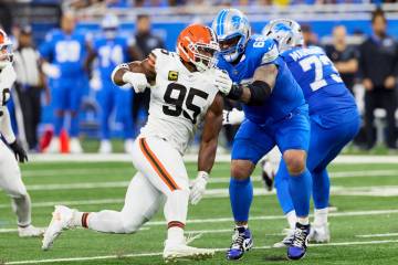 Detroit Lions offensive tackle Taylor Decker (68) blocks Cleveland Browns defensive end Myles G ...