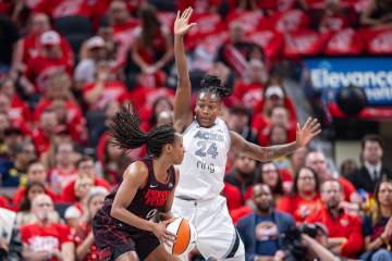 Las Vegas Aces guard Jewell Loyd (24) defends Indiana Fever guard Kelsey Mitchell (0) during th ...