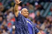 Actor Taylor Wily, also known as Teila Tuli, gestures to fans after throwing out the ceremonial ...