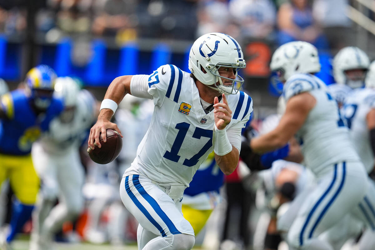 Indianapolis Colts quarterback Daniel Jones (17) scrambles during the first hall of an NFL foot ...