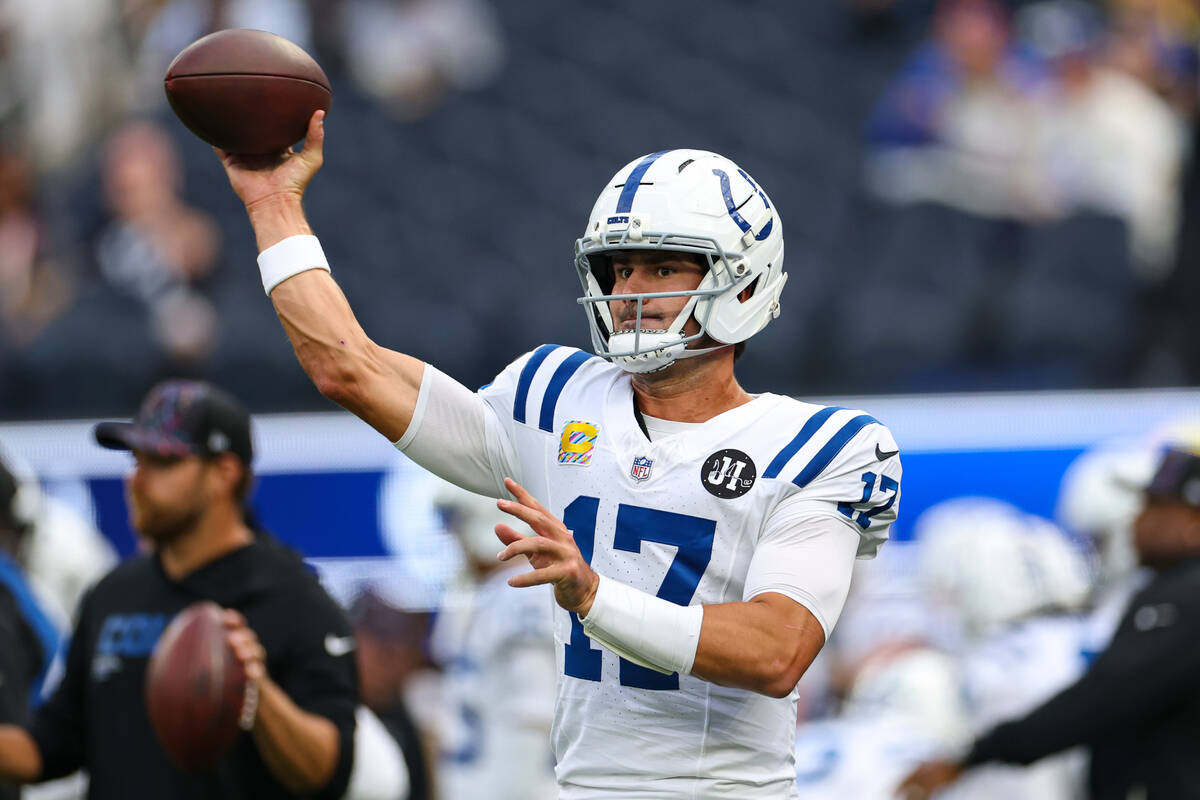 Indianapolis Colts quarterback Daniel Jones (17) throws before an NFL football game against the ...