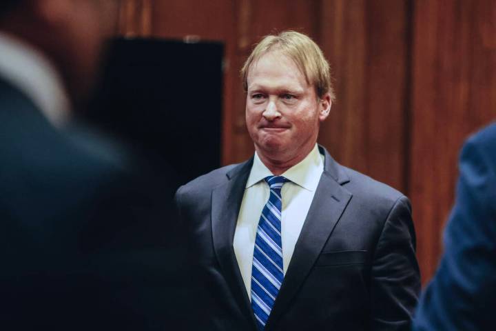 Jon Gruden leaves court after appearing at a hearing for oral arguments in a legal fight betwee ...