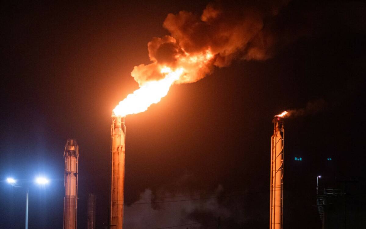 Flames rise from the Chevron refinery in El Segundo, Calif., Thursday, Oct. 2, 2025. (AP Photo/ ...