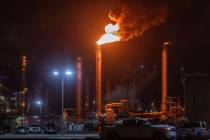 Flames rise from the Chevron refinery in El Segundo, Calif., Thursday, Oct. 2, 2025. (AP Photo/ ...