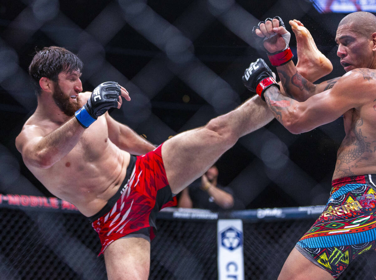 Magomed Ankalaev sends a kick at Alex Pereira during their light heavyweight fight at UFC 313 i ...