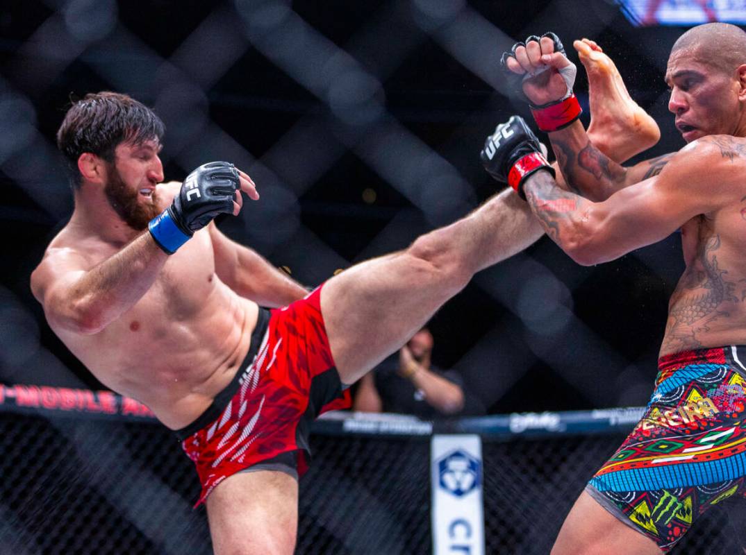 Magomed Ankalaev sends a kick at Alex Pereira during their light heavyweight fight at UFC 313 i ...