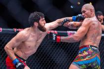Magomed Ankalaev punches Alex Pereira in the face during their light heavyweight fight at UFC 3 ...