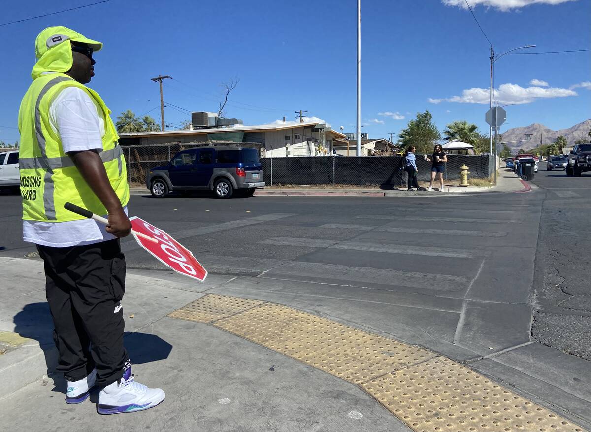 Jerome Davis, crossing guard at Smith Middle School, stands outside the school on Friday, Oct. ...