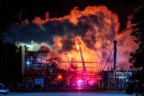 Flames rise from the Chevron refinery in El Segundo, Calif., Thursday, Oct. 2, 2025. (AP Photo/ ...