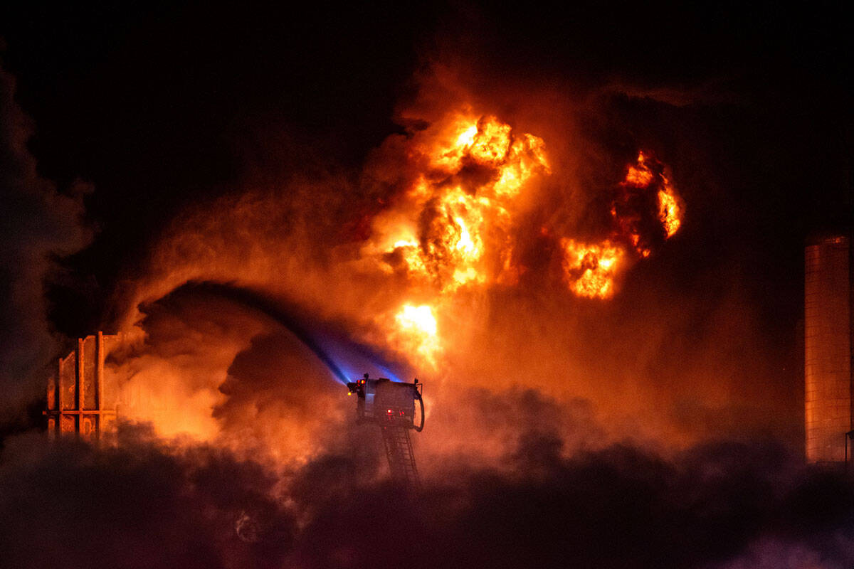Flames rise from the Chevron refinery in El Segundo, Calif., Thursday, Oct. 2, 2025. (AP Photo/ ...