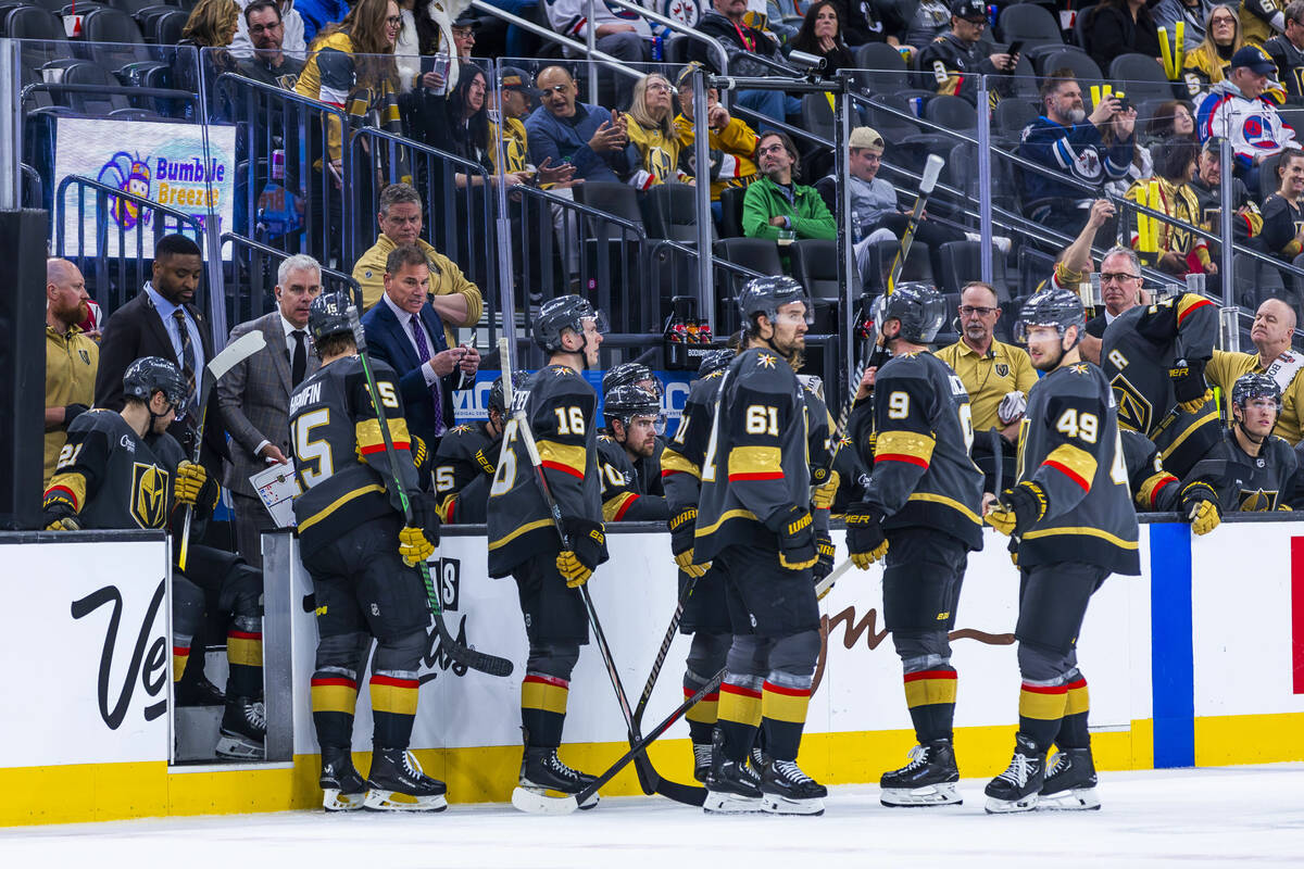 Golden Knights head coach Bruce Cassidy talks with his players on a time out against the Winnip ...