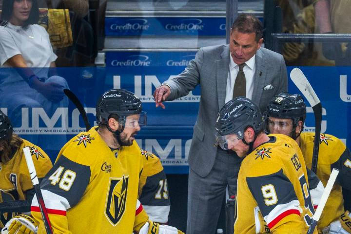 Golden Knights head coach Bruce Cassidy speaks with center Tomas Hertl (48) and center Jack Ei ...