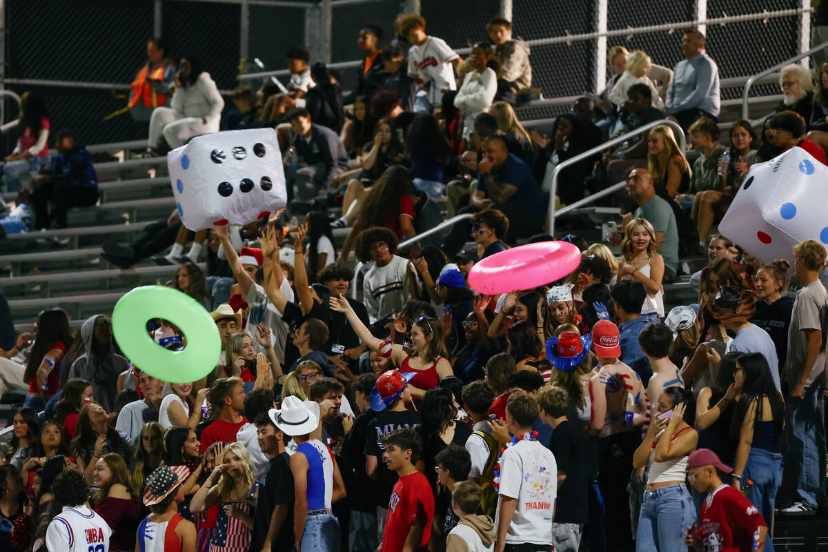 The Shadow Ridge student section plays with giant inflatable dice and inner tubes during the ga ...
