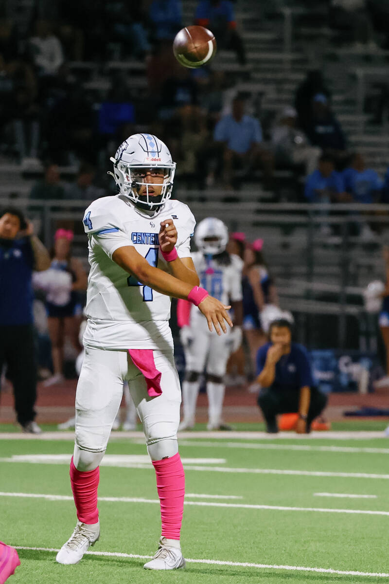 Centennial quarterback Ashton Hunt (4) passes to wide receiver Brogan Church (14) (not pictured ...