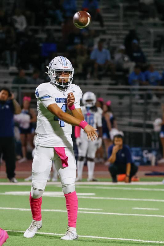Centennial quarterback Ashton Hunt (4) passes to wide receiver Brogan Church (14) (not pictured ...